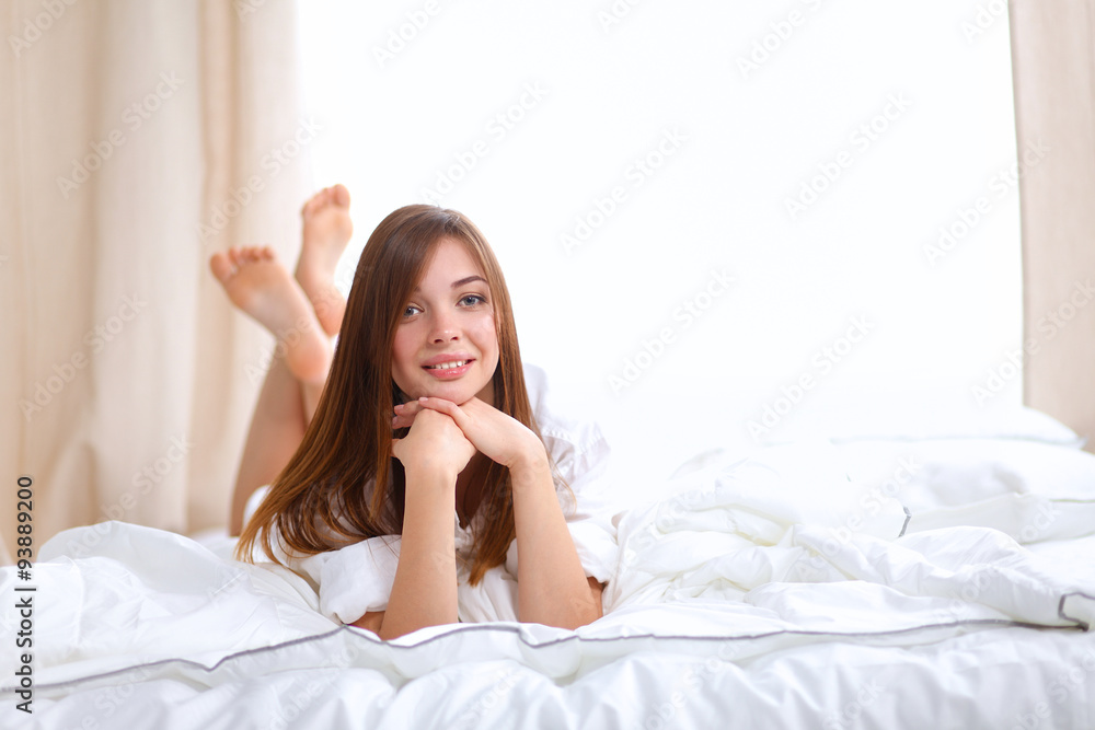 Portrait of beautiful woman on bed at bedroom Portrait of beautiful woman on bed at bedroom