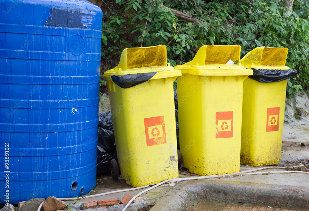 Different colored bins to separate waste Different colored bins to separate waste