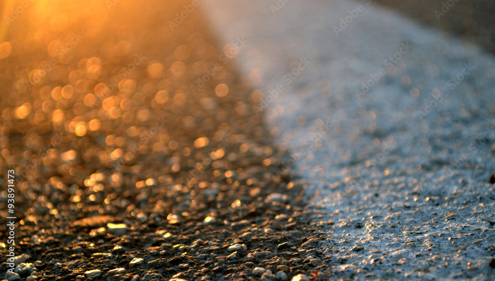 asphalt road and orange sunset asphalt road and orange sunset