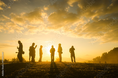 Group Of People standing with Sunrise Concept