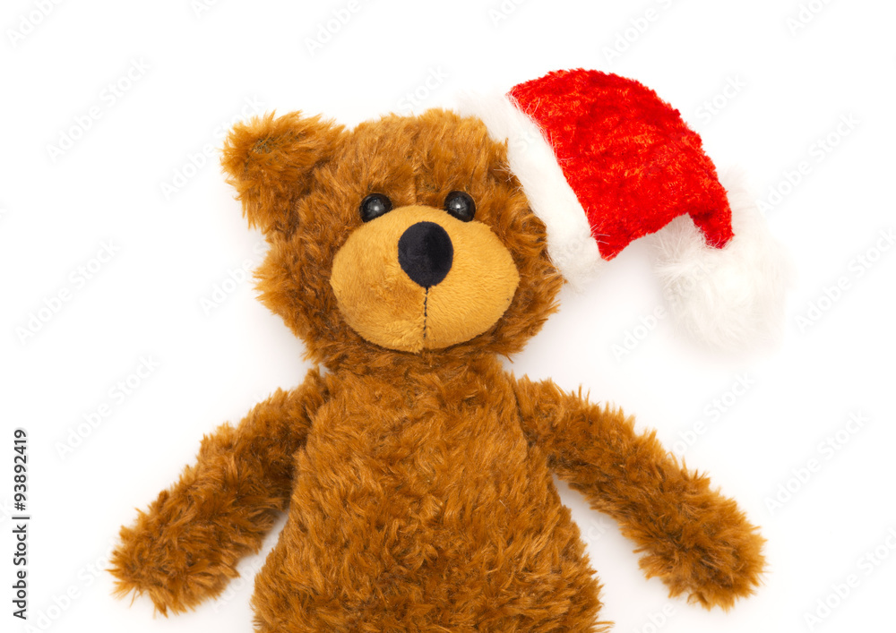vintage teddy bear with santa hat on white background, christmas decoration