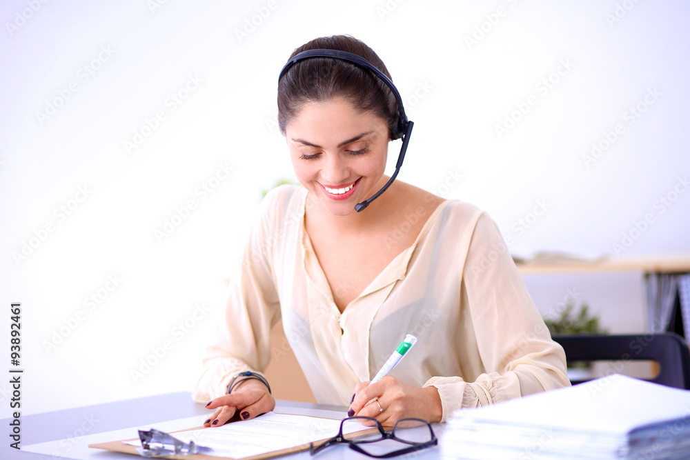 Close-up portrait of a customer service agent sitting at office Close-up portrait of a customer service agent sitting at office