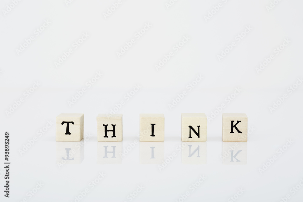 'Think' spelled in game tiles on white background 'Think' spelled in game tiles on white background