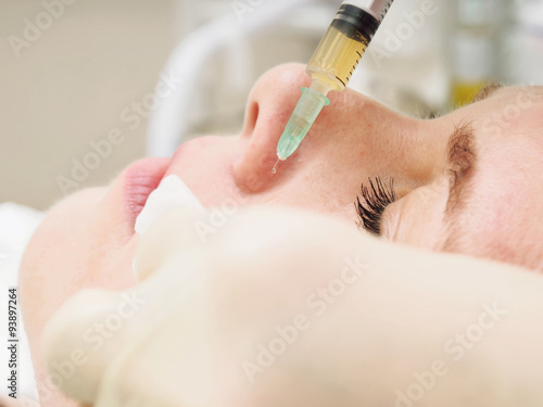 Cosmetology procedure mesoteraphy. Rejuvenation revitalization, skin nutrition, wrinkle reduction. Doctor making microneedle injection.