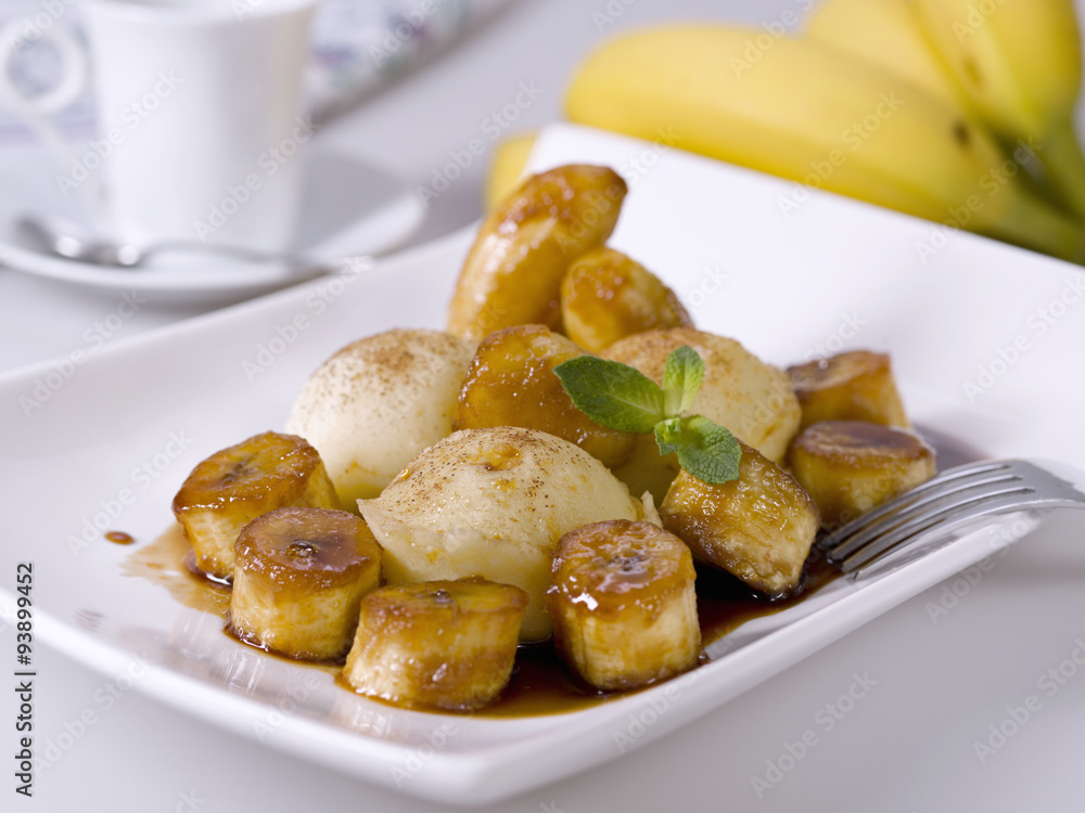 Bananas Foster-style dish on white. Typical American food. Bananas Foster-style dish on white. Typical American food.