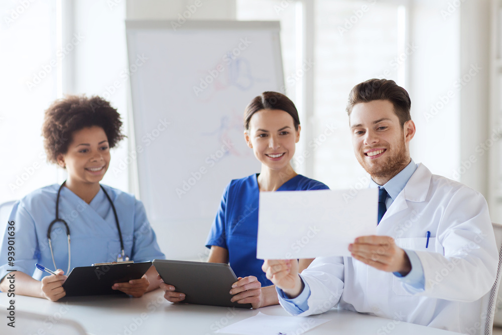 group of happy doctors meeting at hospital office group of happy doctors meeting at hospital office