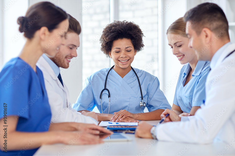 group of happy doctors meeting at hospital office group of happy doctors meeting at hospital office