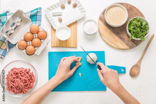 Good-looking female hands while preparing delicious traditional italian meatballs