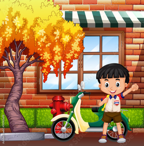 Little boy and motocycle on street