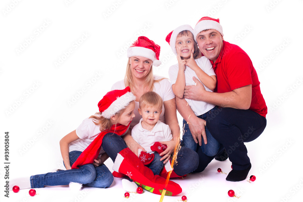 Happy cute family in santa's hats Happy cute family in santa's hats