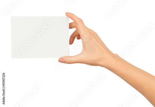 Humans right hand holding small white paper