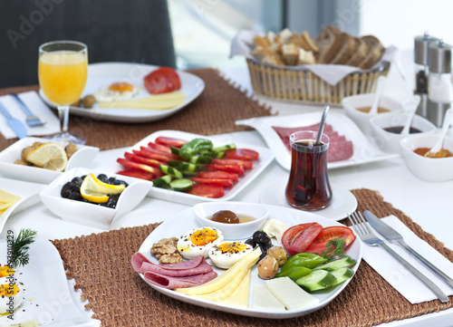 Rich and delicious Turkish breakfast on white wood table