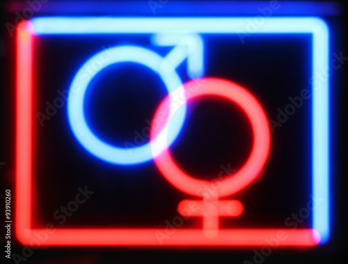 Abstract defocused blurred red and blue neon sign at the entranc photo