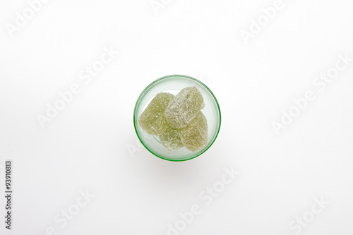 green marmalade in green wineglass on white