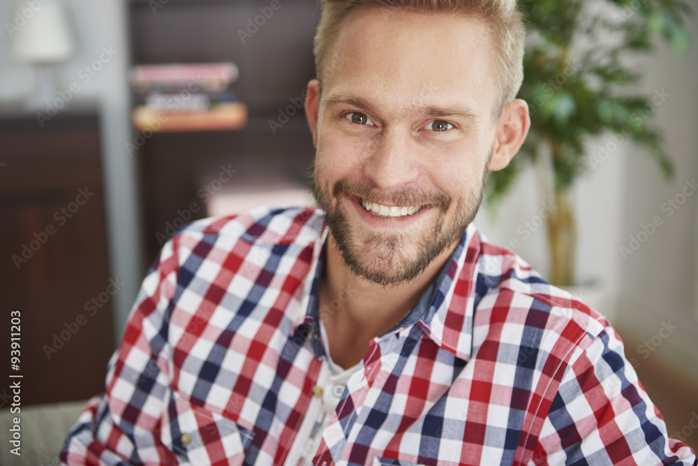 Portrait of a handsome man in the living room Portrait of a handsome man in the living room