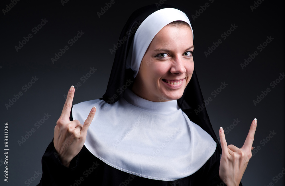 Funny nun showing victory sign Funny nun showing victory sign