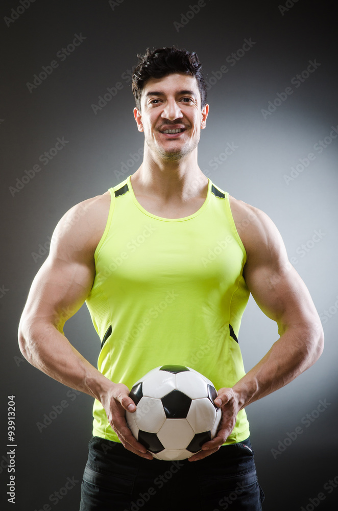 Muscular man with football ball Muscular man with football ball