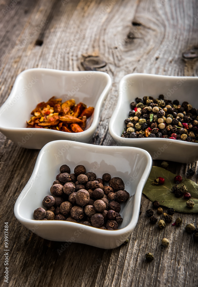different kinds of pepper in bowls different kinds of pepper in bowls