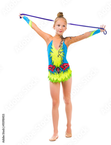 little gymnast holding a skipping rope over her head