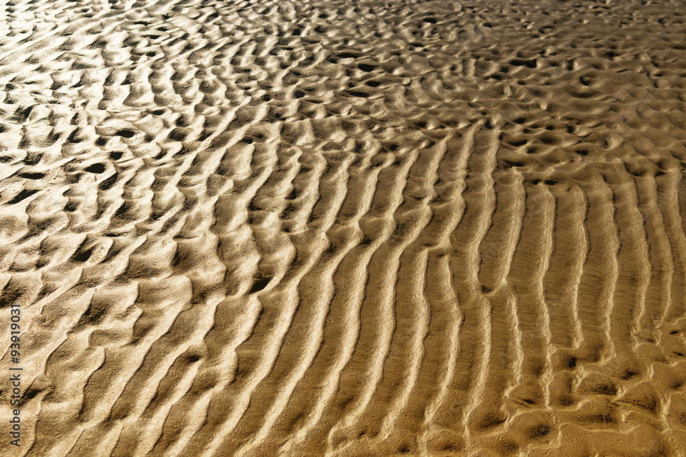 Yellow sand sea beach after the tide on a sunny day Yellow sand sea beach after the tide on a sunny day