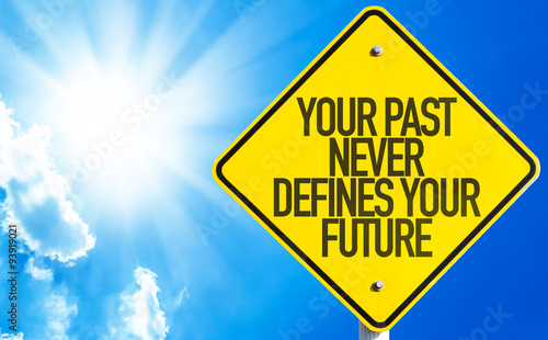 Your Past Never Defines Your Future sign with sky background photo