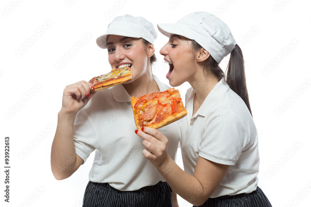Twin hungry sisters with pizza on white background Twin hungry sisters with pizza on white background