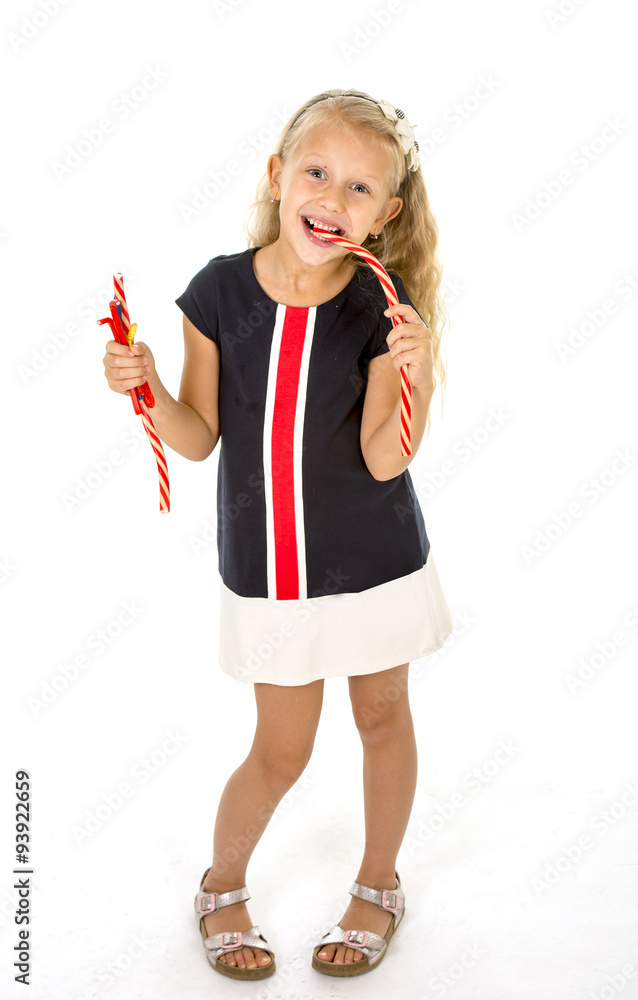 beautiful little female child with blue eyes eating strawberry licorice candy beautiful little female child with blue eyes eating strawberry licorice candy