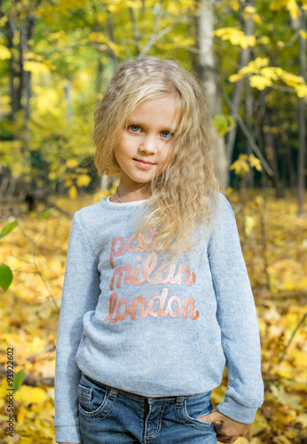  Beautiful young girl in autumn forest park