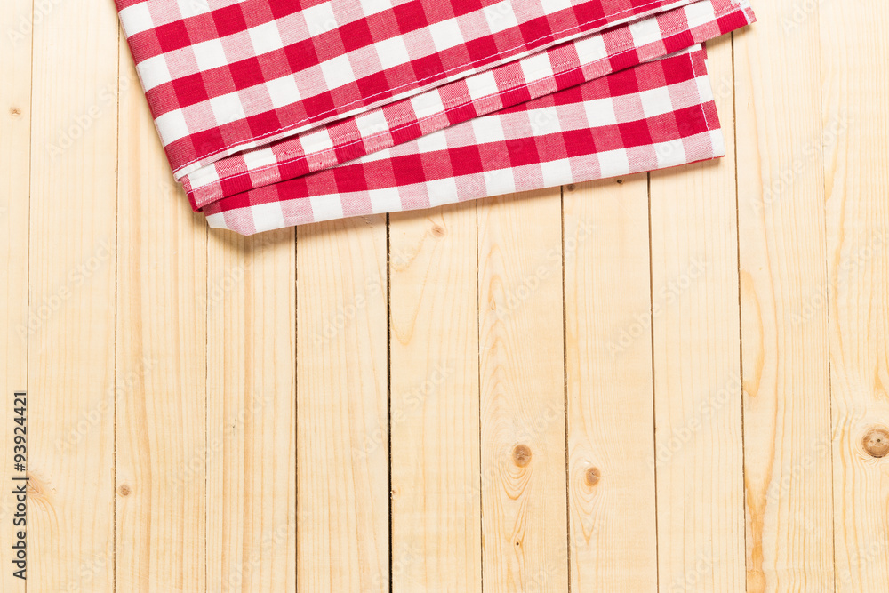 Red and white tablecloth on white wooden table Red and white tablecloth on white wooden table