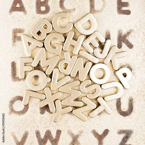 Gold English alphabet on a gold background