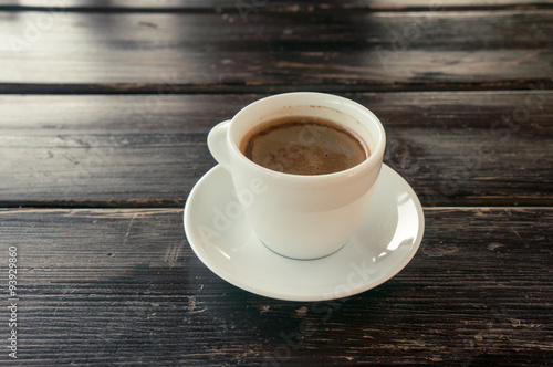 Cup of coffee on a wooden table