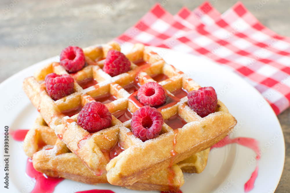 Waffles with raspberries and strawberry syrup Waffles with raspberries and strawberry syrup