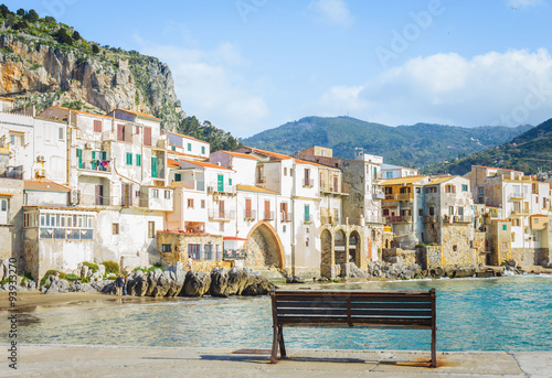 Cefalu beachfront with old building, Sicily, Italy photo