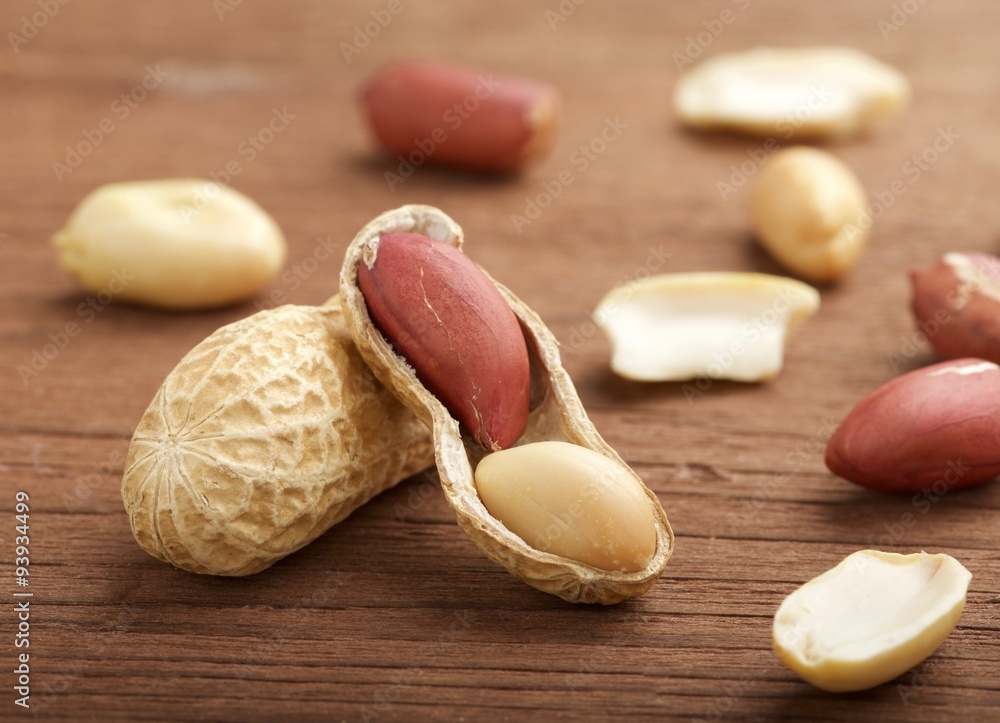 peanuts on wooden background peanuts on wooden background