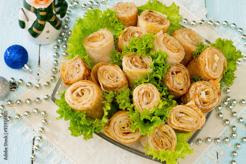 Herring pancake rolls with salad of fresh leaves