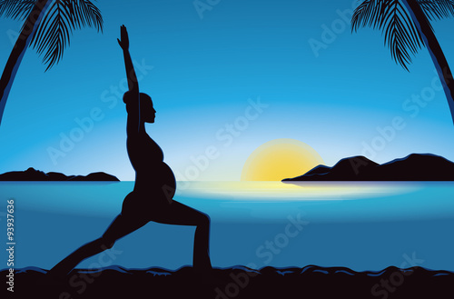 Silhouette of pregnancy woman doing exercise with yoga  in seaside at the sunset time for good prenatal.