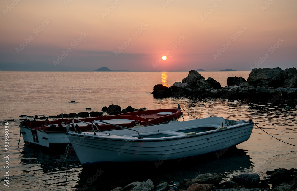 summer sunset over the sea and  boats