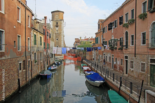 VENICE  ITALY - SEPTEMBER 04  2012   Rio de Sant Ana in sestiere Castello with boats and colorful facades of old medieval houses in Venice  Italy