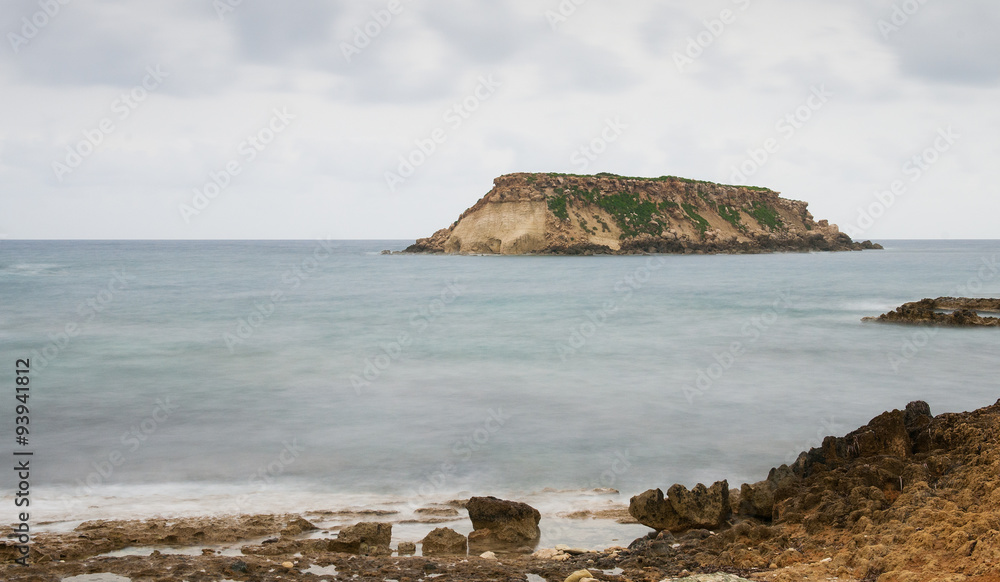 Rocky Seascape with the island of  geronisos Paphos, Cyprus