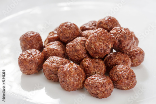 Cereal chocolate balls on white plate