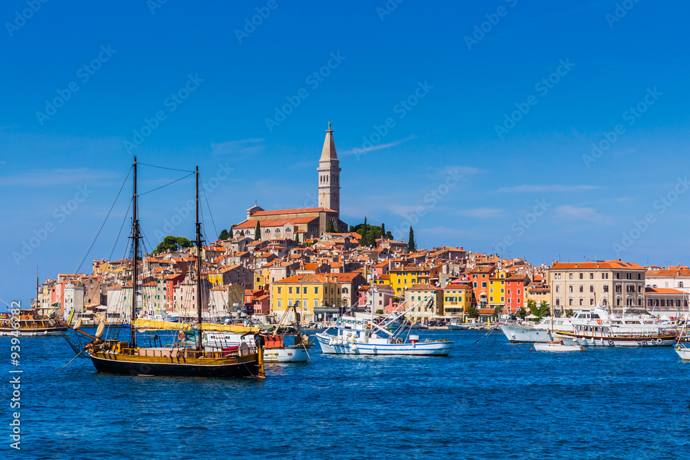 A galleass anchored among ships in the Adriatic sea with a view of the old city core buildings on the coast A galleass anchored among ships in the Adriatic sea with a view of the old city core buildings on the coast
