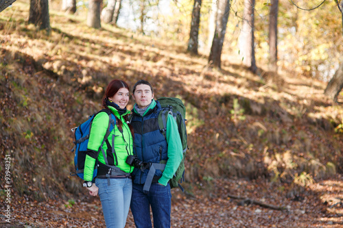 woman and man walking in park