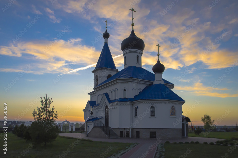 Belarus, Minsk: orthodox church of Saint Nicholas The Wonderworker beams of the setting sun.