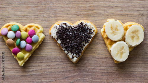 Three waffles with fruit and chocolate