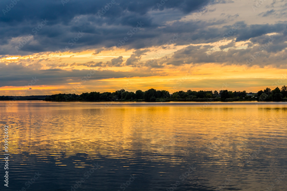 Sunset with dramatic sky over Nove Mlyny lake, Mikulov, Czech Republic