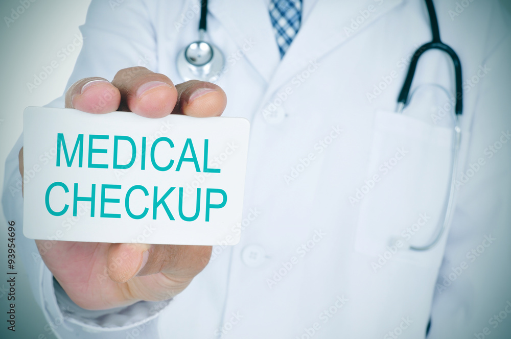 doctor showing a signboard with the text medical checkup doctor showing a signboard with the text medical checkup