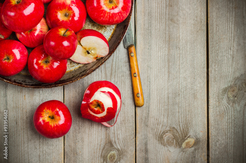 Fresh red organic apples on a rustic table