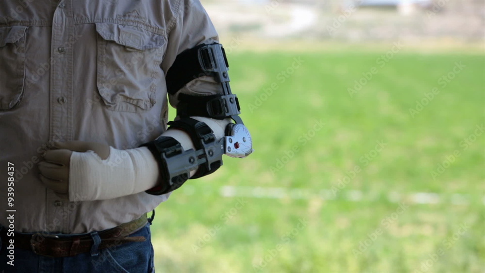 Mature man in arm brace after surgery HD 8223 Mature man in arm brace after surgery HD 8223