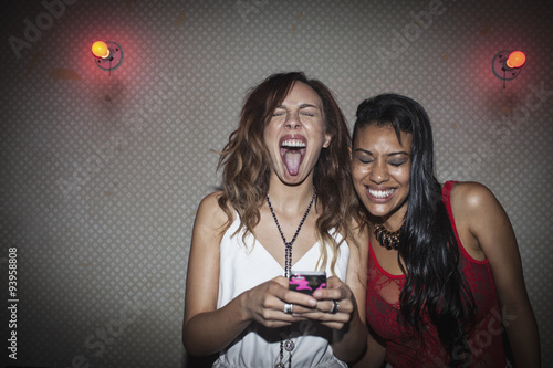 Friends hanging out at a nightclub photo