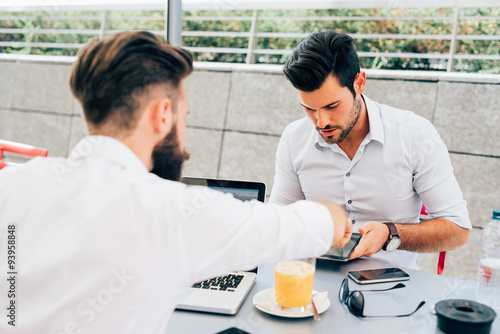 Two young modern businessman using pc and tablet © Eugenio Marongiu